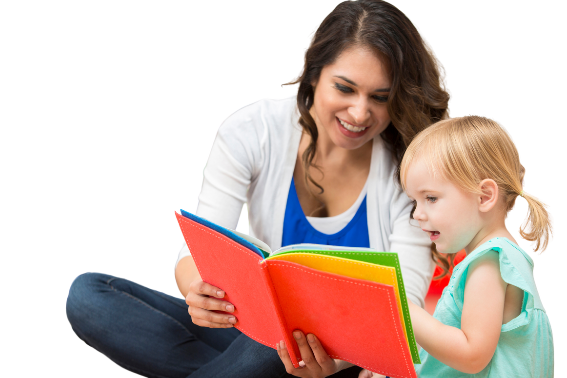 Hispanic preschool teacher reading a book to cute toddler girl